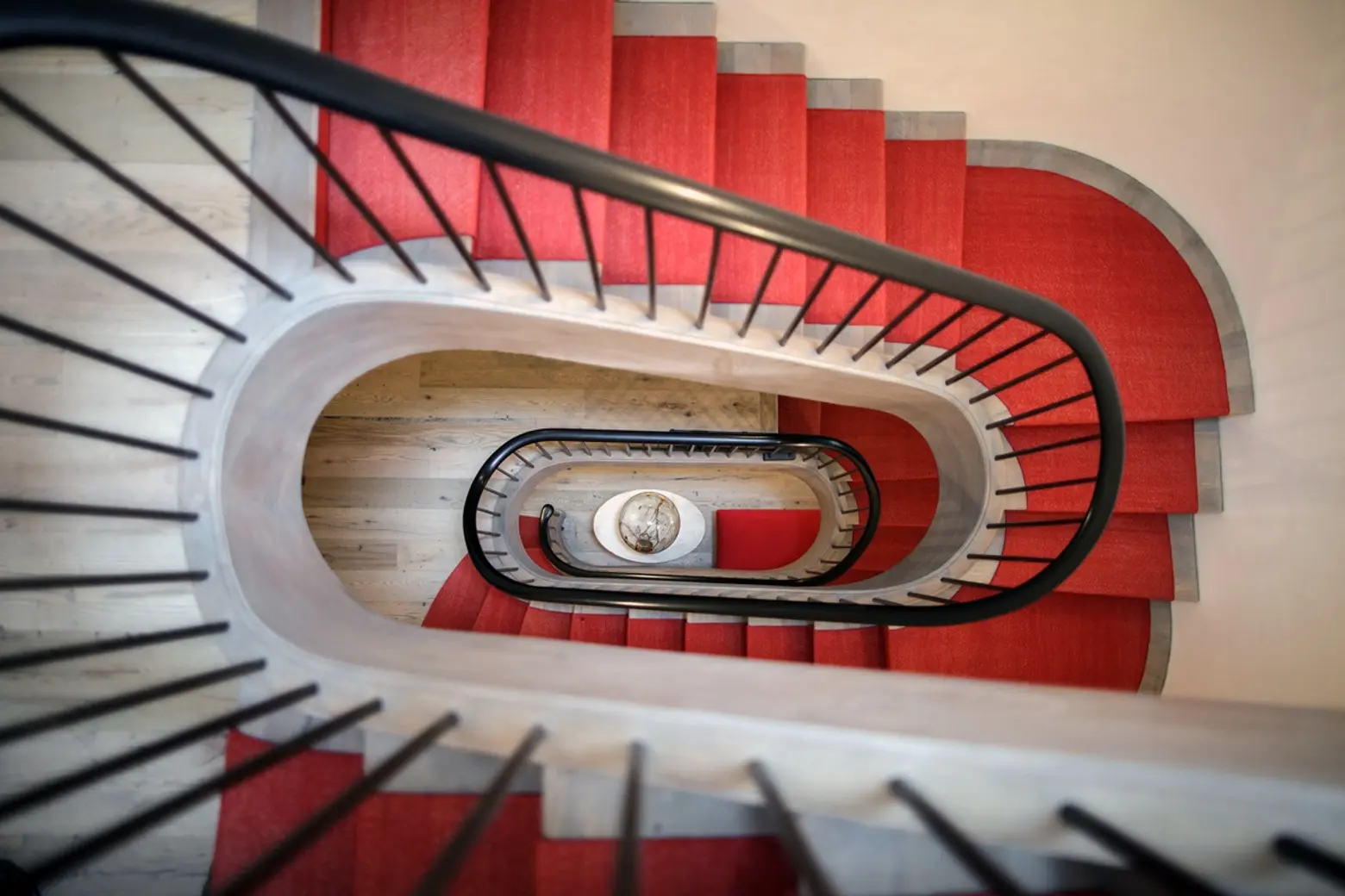  renovations chelsea, historic homes nyc, grand staircase, red stairwell