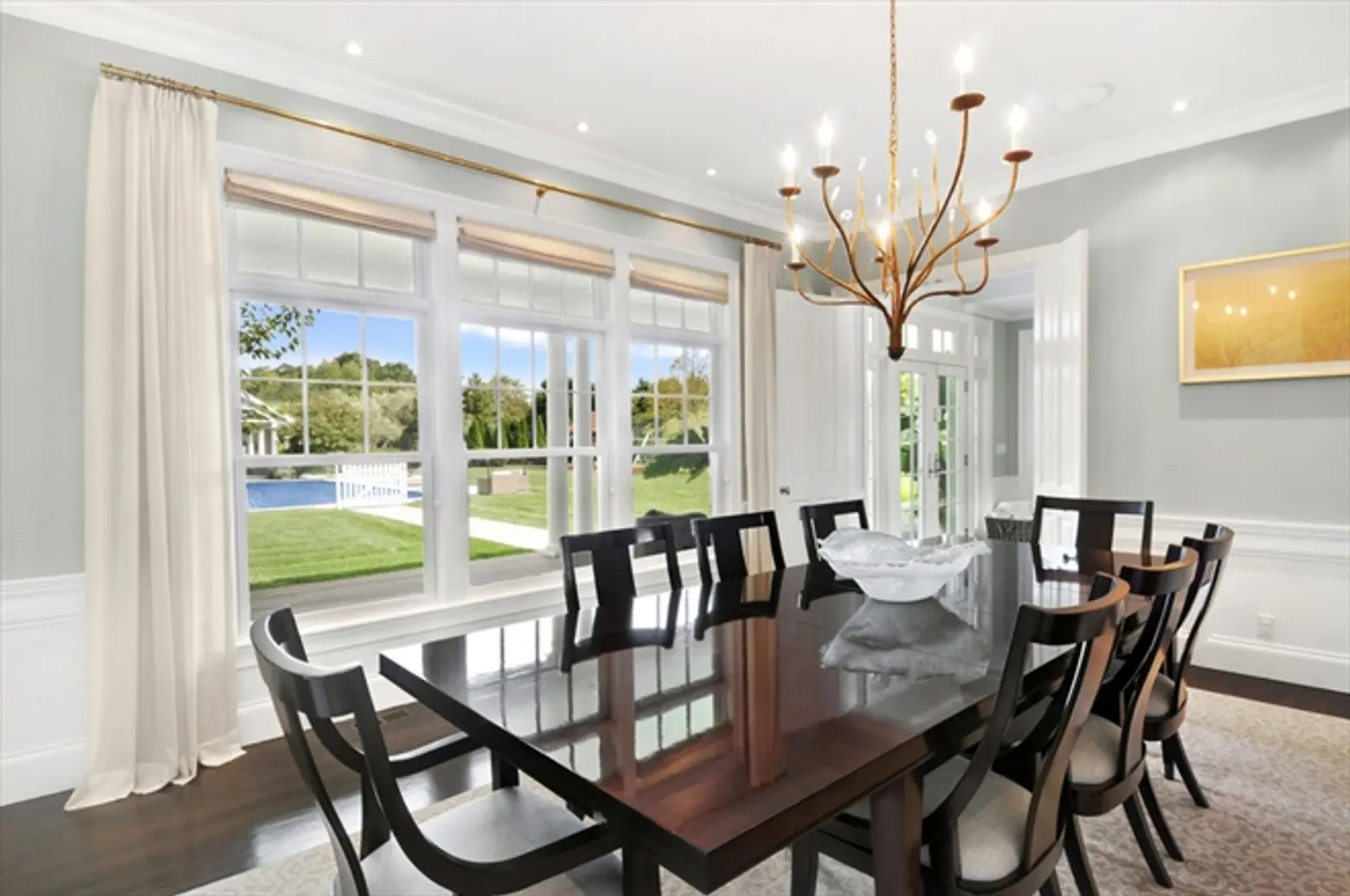 homes hamptons, famous homes for sale, tennis court hamptons, beach style furnishings, dark wood dining room table