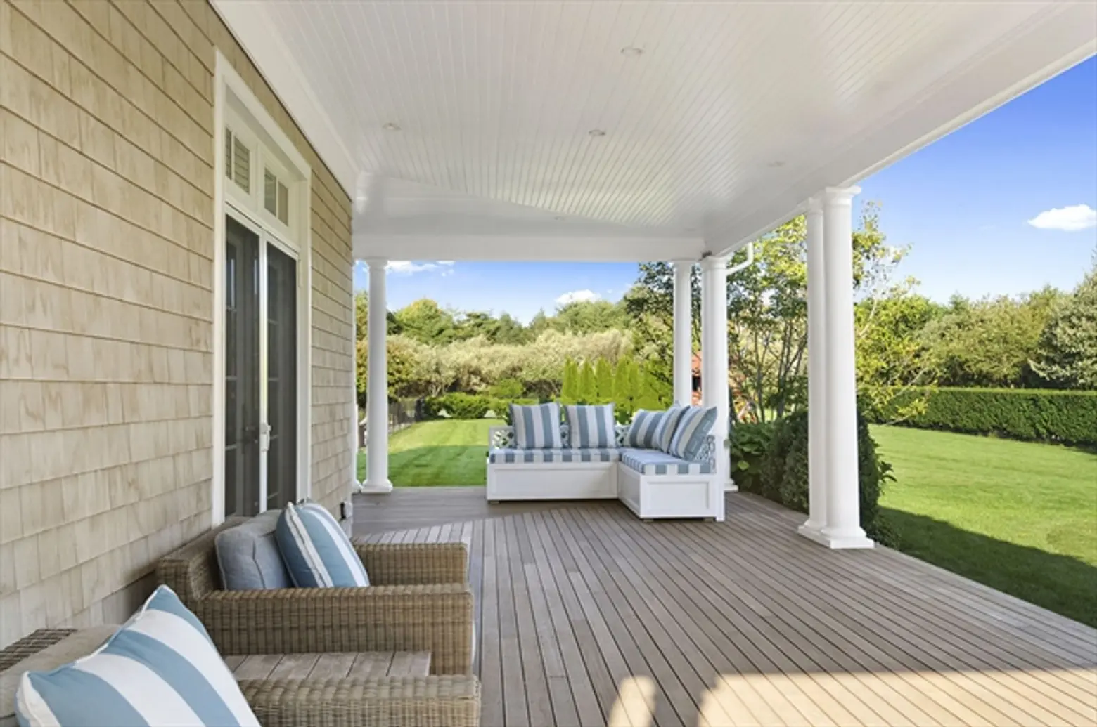 homes hamptons, famous homes for sale, tennis court hamptons, beach style furnishings, wrap around porch