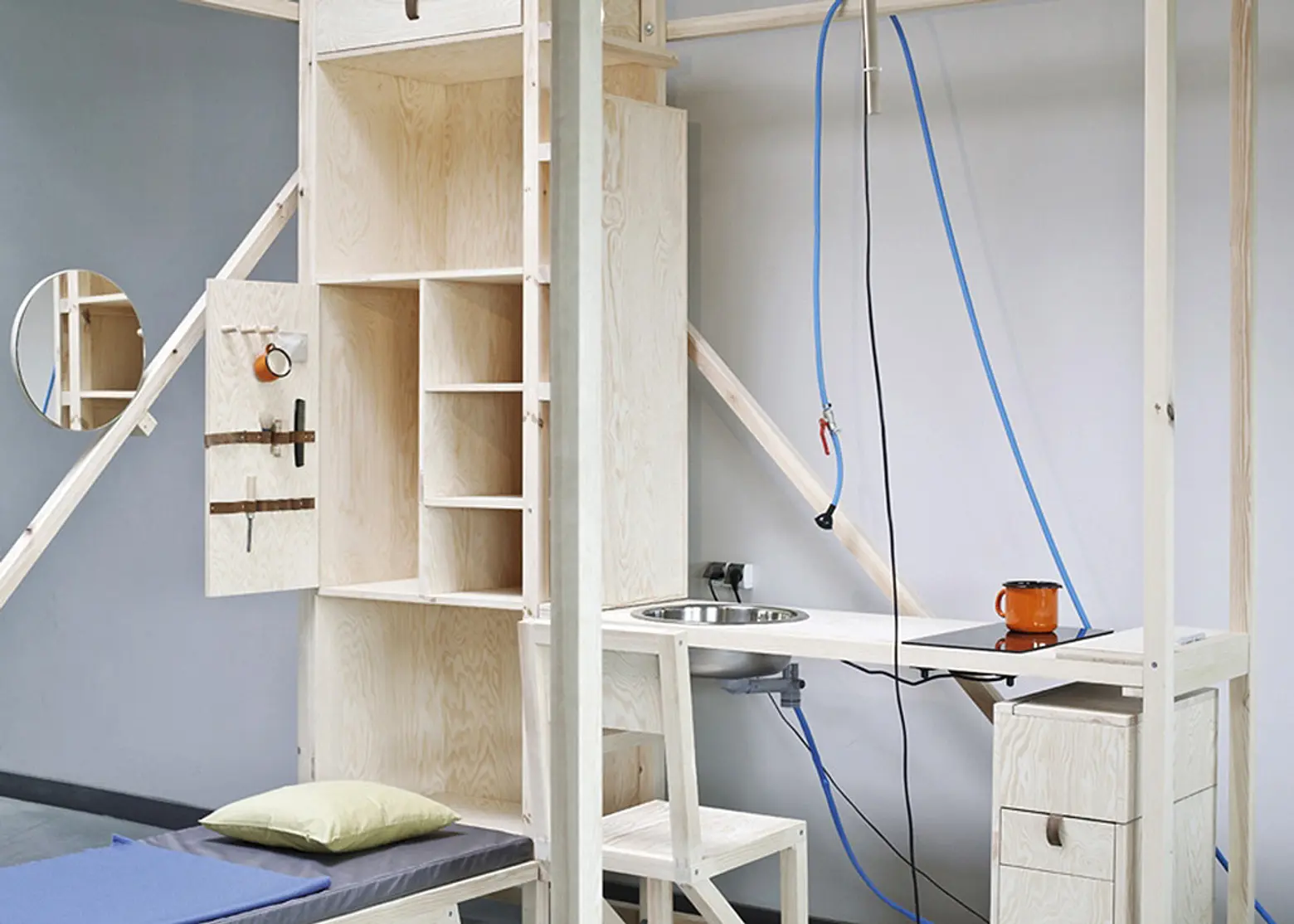 Maciej Chmara and Ania Rosinke, minimal living unit, 2,5³, Viennese design, Papanek, multifunctional living space, wooden cube, Contemporary Nomadism
