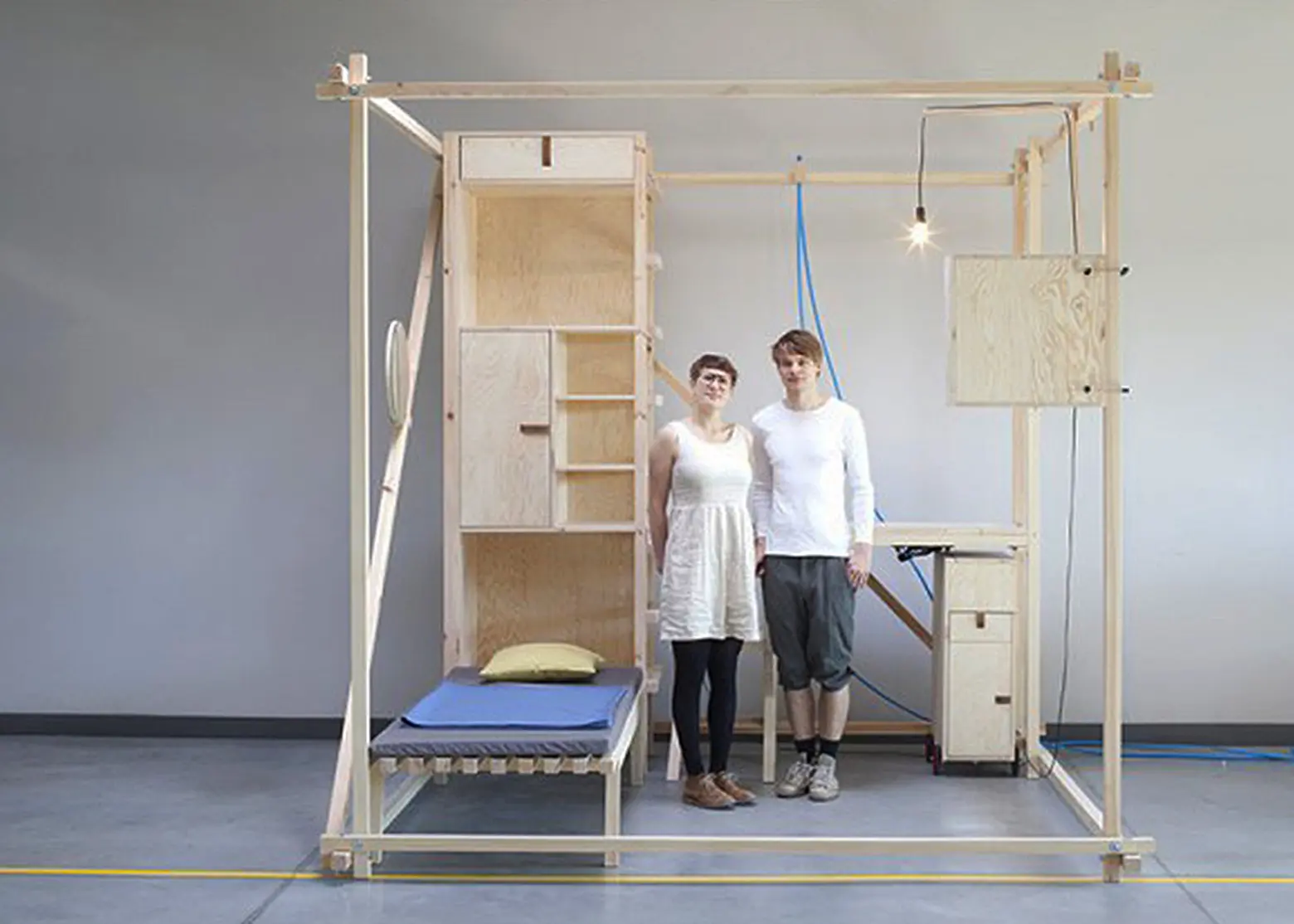 Maciej Chmara and Ania Rosinke, minimal living unit, 2,5³, Viennese design, Papanek, multifunctional living space, wooden cube, Contemporary Nomadism