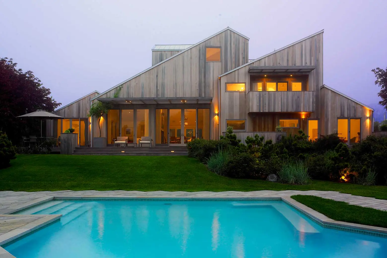CCS Architecture, wood clad, Bridgehampton Residence, The Hamptons, multigenerational home, indoor/outdoor living, wooden deck, secluded entrance, eating al fresco, Cass Calder Smith founded, modernist home, house extension, house renovation