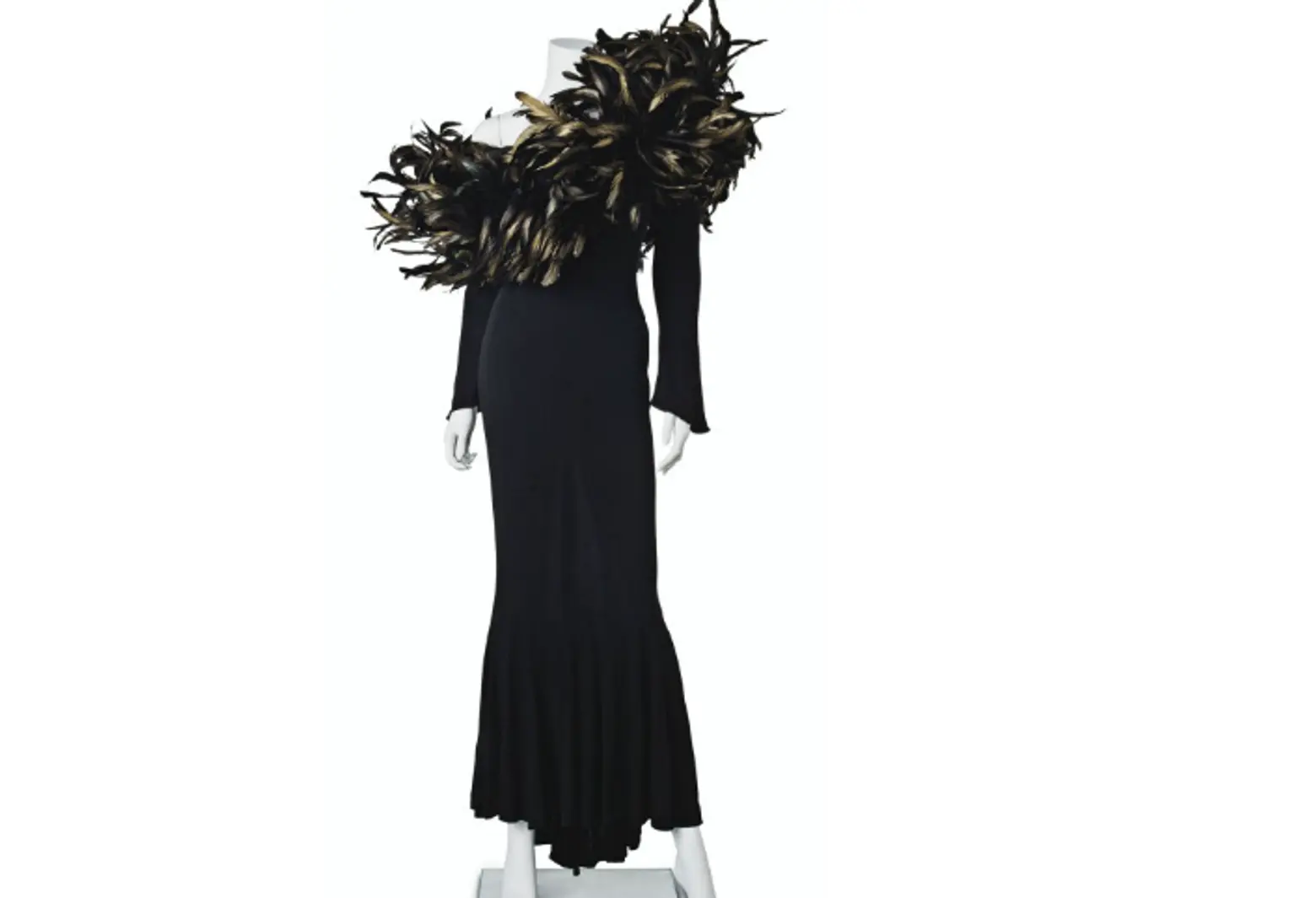 A BLACK JERSEY AND FEATHER-EMBELLISHED LONG-SLEEVED GOWN