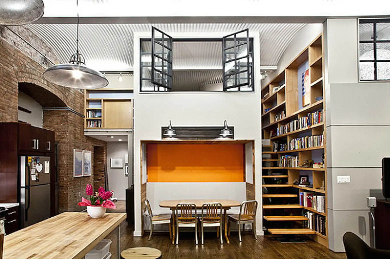 Wooden Accents and Pops of Color Add a Dash of Coziness to This Industrial Loft by Design42