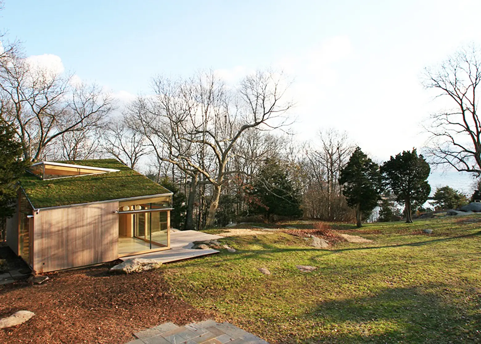 Tranquil Wooden Cottage by Gray Organschi Architecture is Topped by a Lush, Moss Roof