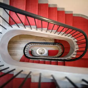 renovations chelsea, historic homes nyc, grand staircase, red stairwell
