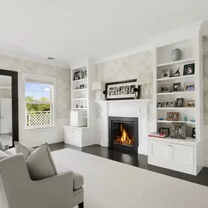 homes hamptons, famous homes for sale, tennis court hamptons, white living room, elegant fireplaces