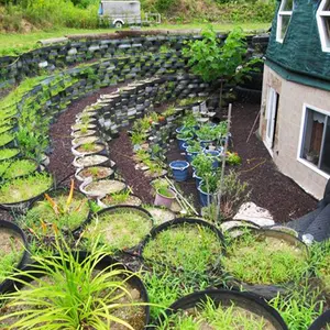Kevin Shea, Long Island Green Dome, family home, largest geodesic dome-home in the world, terraced garden, recycled tires, green roof, spider web green roof, fruit trees, crosed circulation, daylight