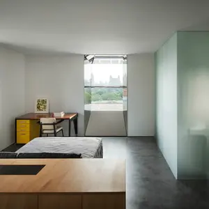 Minimalist Renovation, Thomas Phifer, Jill Sander's CEO, Fifth Avenue Apartment, Constance Darrow, and her husband Angelo Lombardi, ultra minimalistic home, ultra modern, Whitney Museum of American Art, Jean Prouvé, Jean Royère.