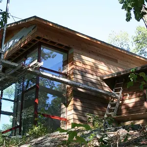 GRADE, elegant rustic, novelist home, Ridge House, Hudson River, forest views, woodland retreat, timber-imprinted concrete