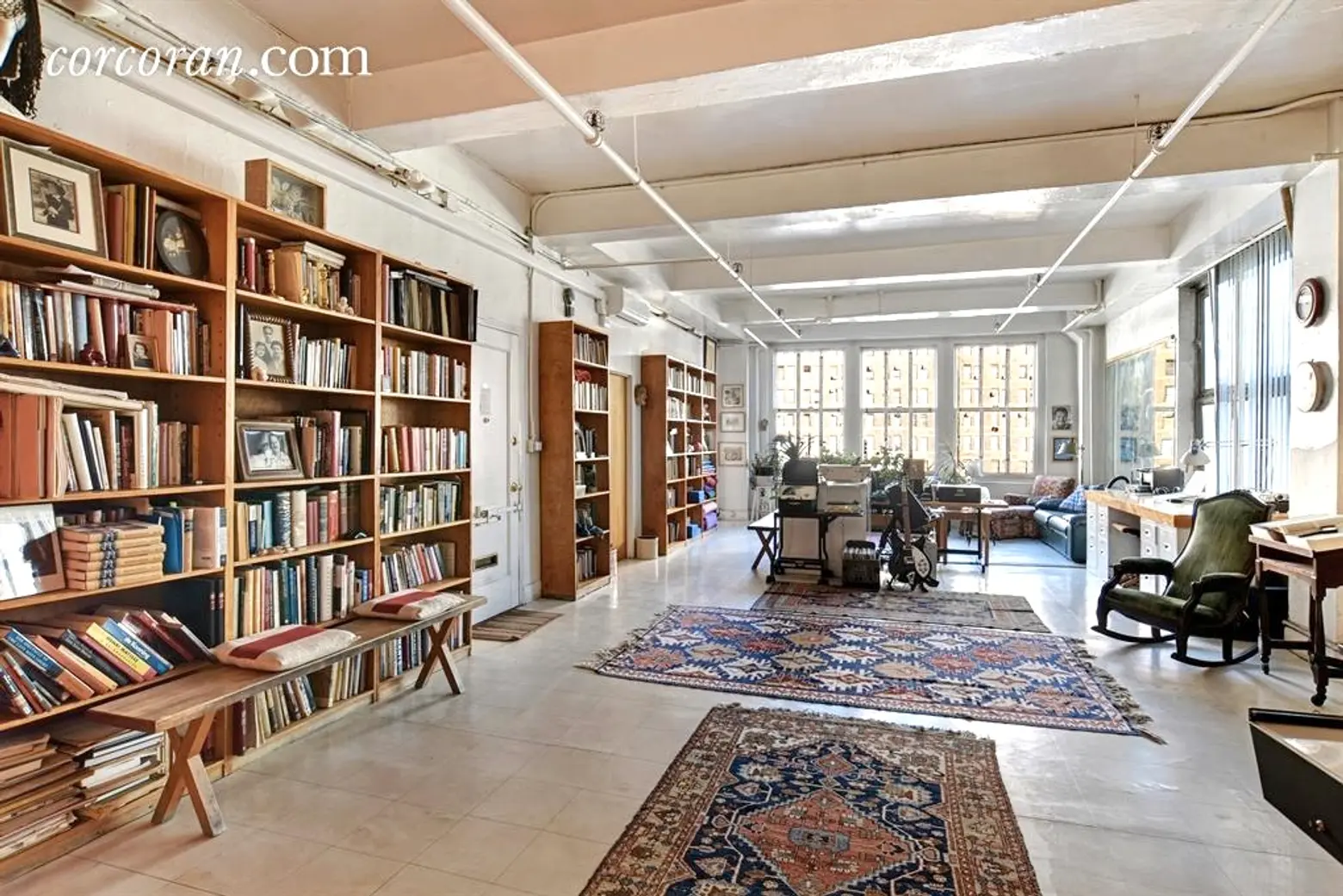 Rows of Bookshelves Under 11-Foot Ceilings Line This $2M Nomad Loft