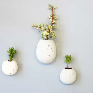 Studio Harm en Elke, ceramic flower pot, Wall flowers, glazed ceramic, small plants vessel, ceramic wall pocket, Design Academy of Eindhoven, Sectie-C, Eindhoven, Dutch design