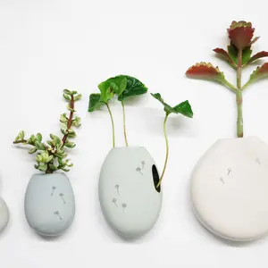 Studio Harm en Elke, ceramic flower pot, Wall flowers, glazed ceramic, small plants vessel, ceramic wall pocket, Design Academy of Eindhoven, Sectie-C, Eindhoven, Dutch design