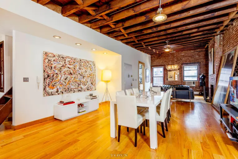 A 32-Foot Long Living Room with Exposed Brick Dominates This Hell’s Kitchen Loft Rental