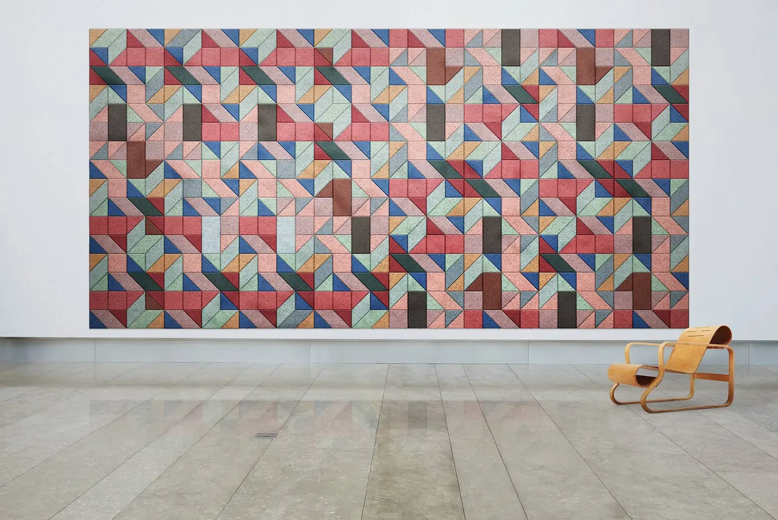 Geometric sound-absorbing wall panels are made from wood wool