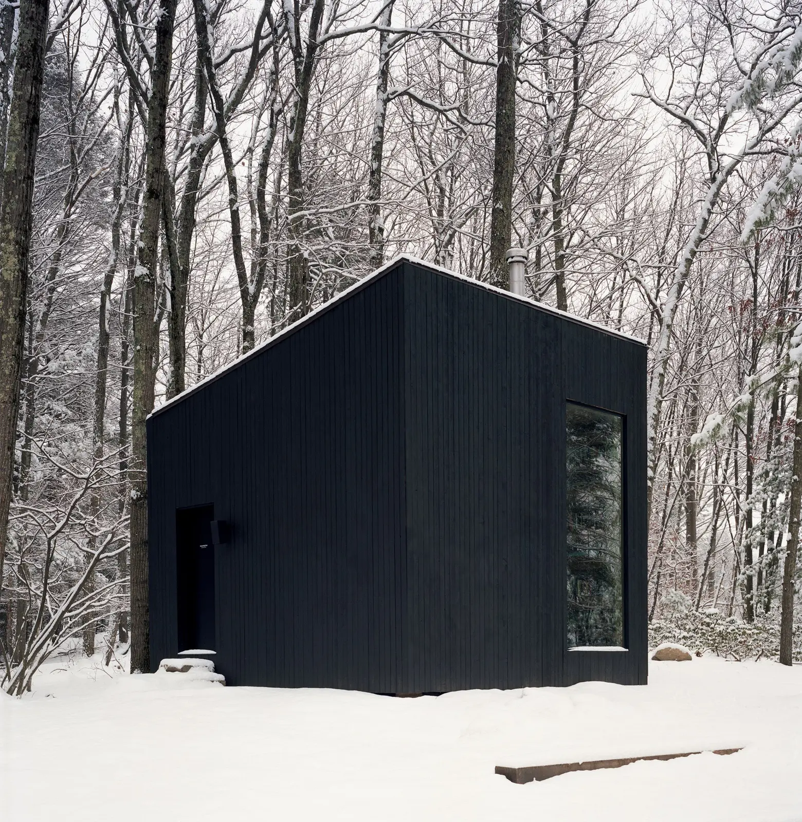 Studio Padron and SMITH Design, one room black cabin in Upstate New York. Photo by Jason Koxvold