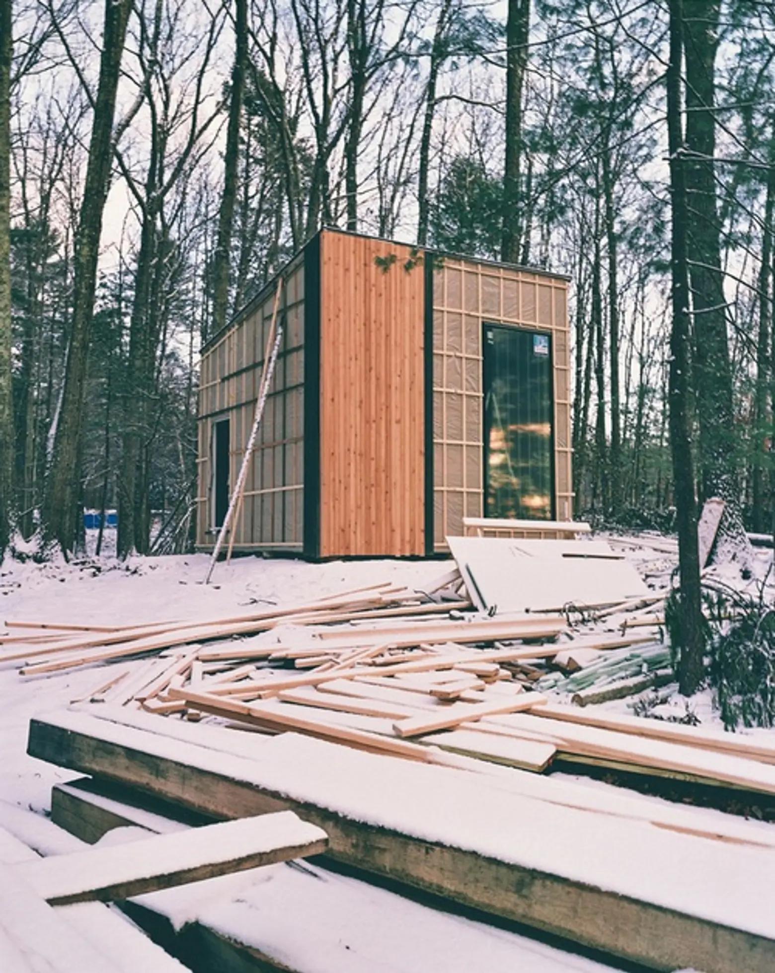 Studio Padron black cabin exterior during construction. Photo by Jason Koxvold