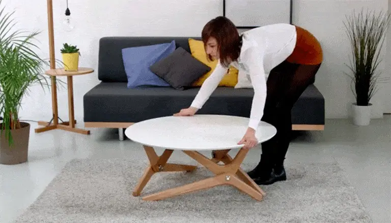 Boulon Blanc transforms from coffee table to dining room table in one motion