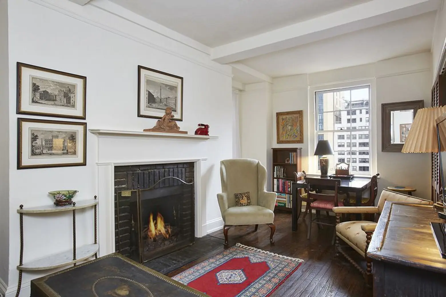Curl up by the fire in this cozy East Side one-bedroom for only $495K