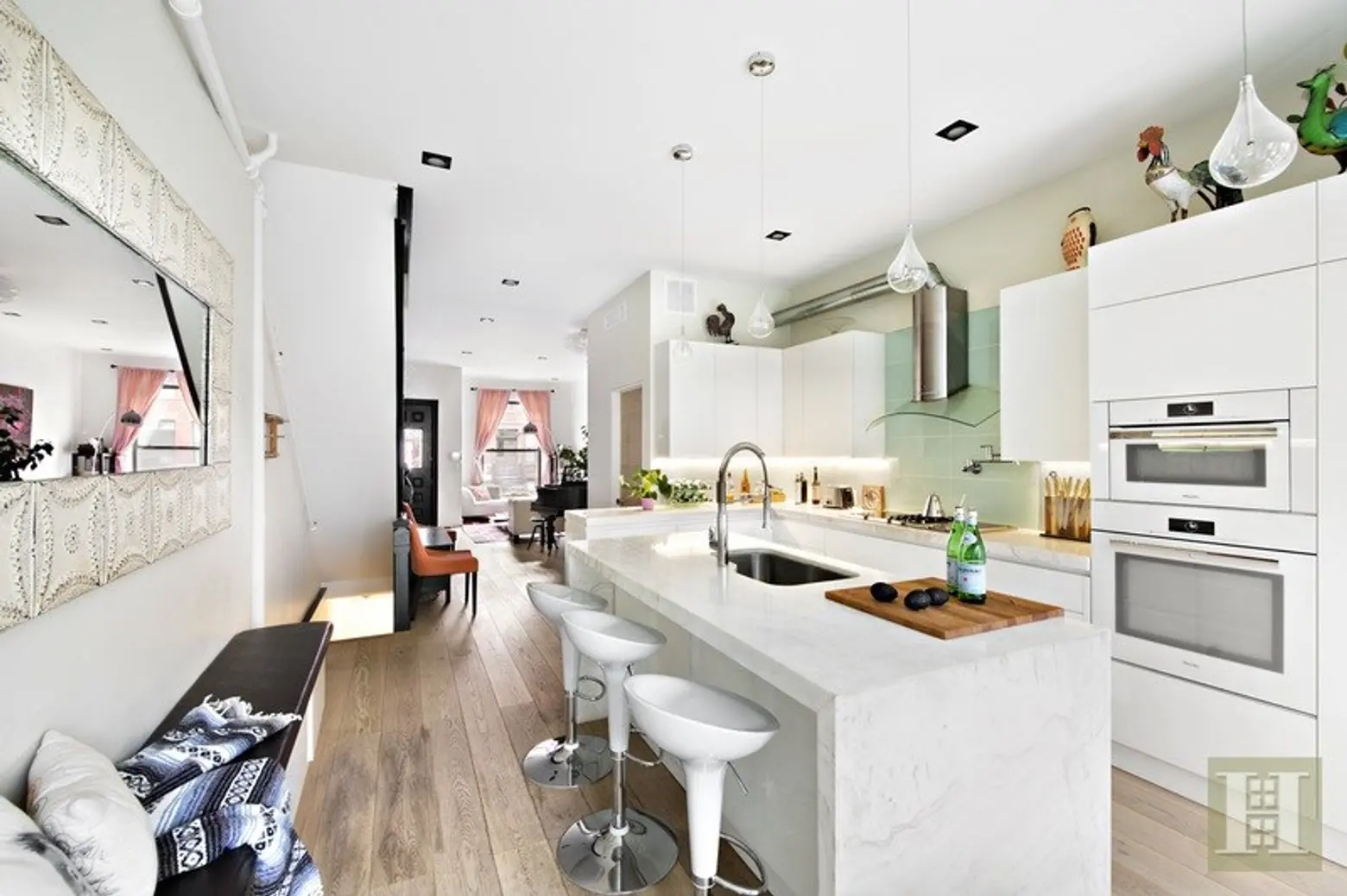 $2.95M for a modernized townhouse with a glass terrace right in Central Harlem