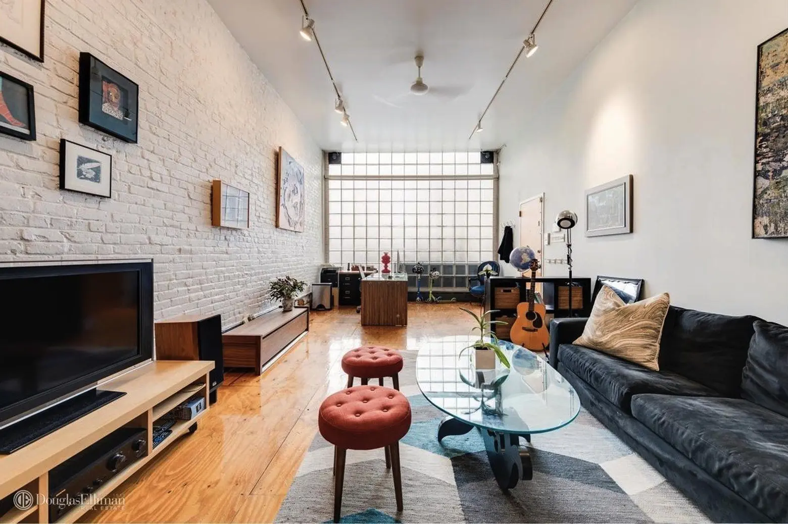 $4.5M multi-family townhouse in Williamsburg boasts glass walls and a floating staircase