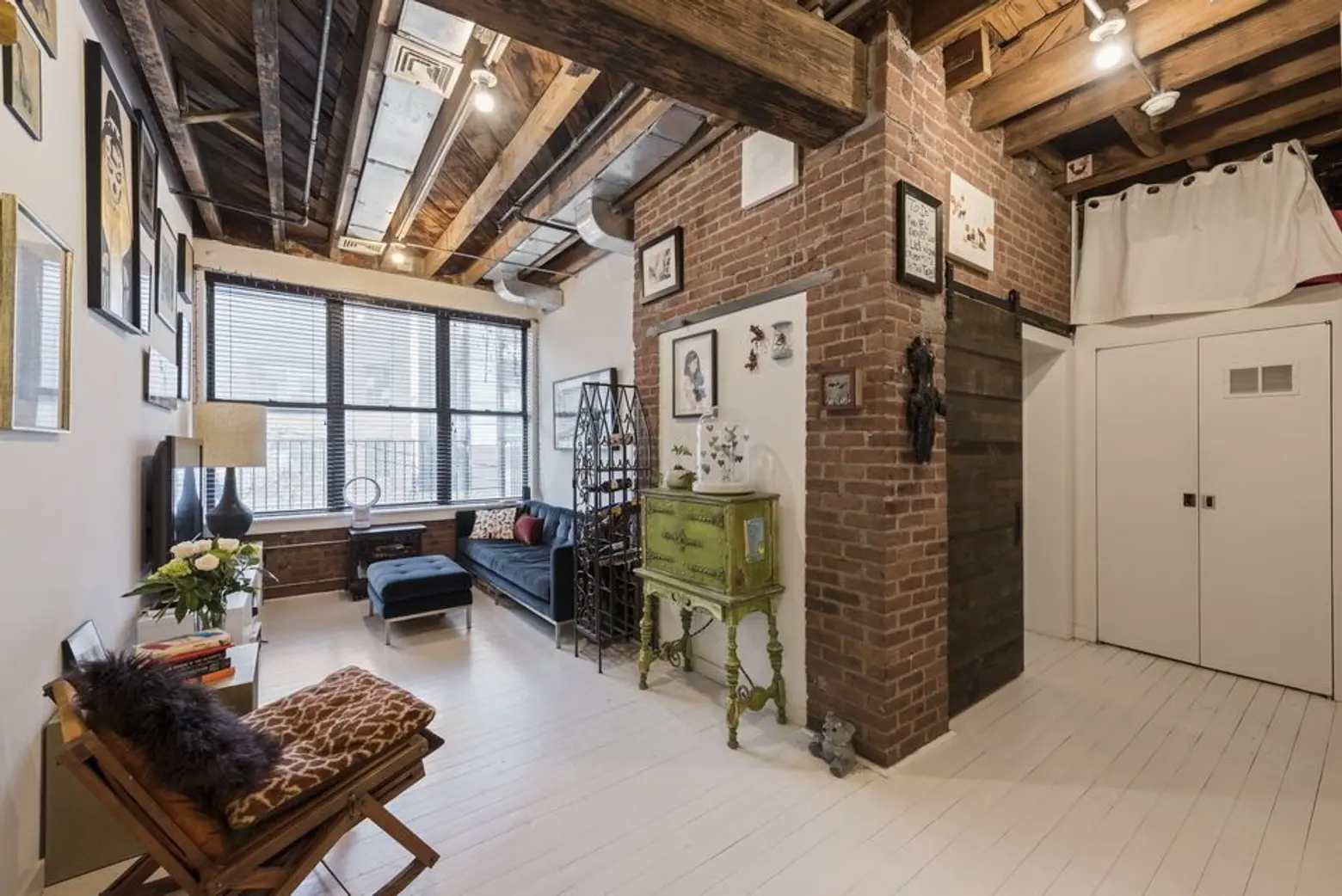 Bakery-turned-condo in Williamsburg holds an incredible apartment lined with exposed brick and beams