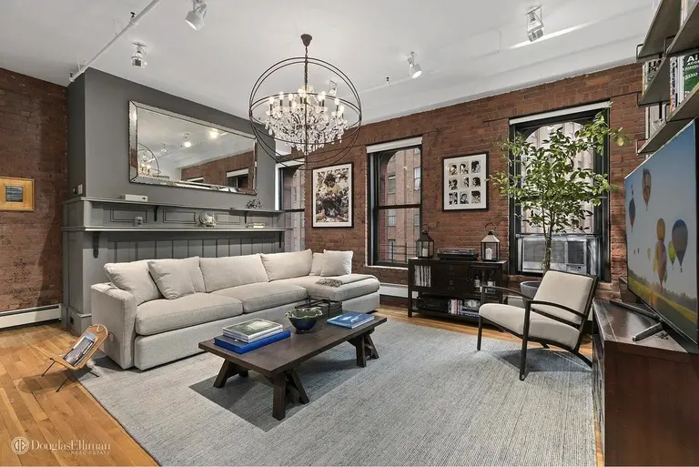 Brick archways and timber beams decorate this $2M Tribeca co-op