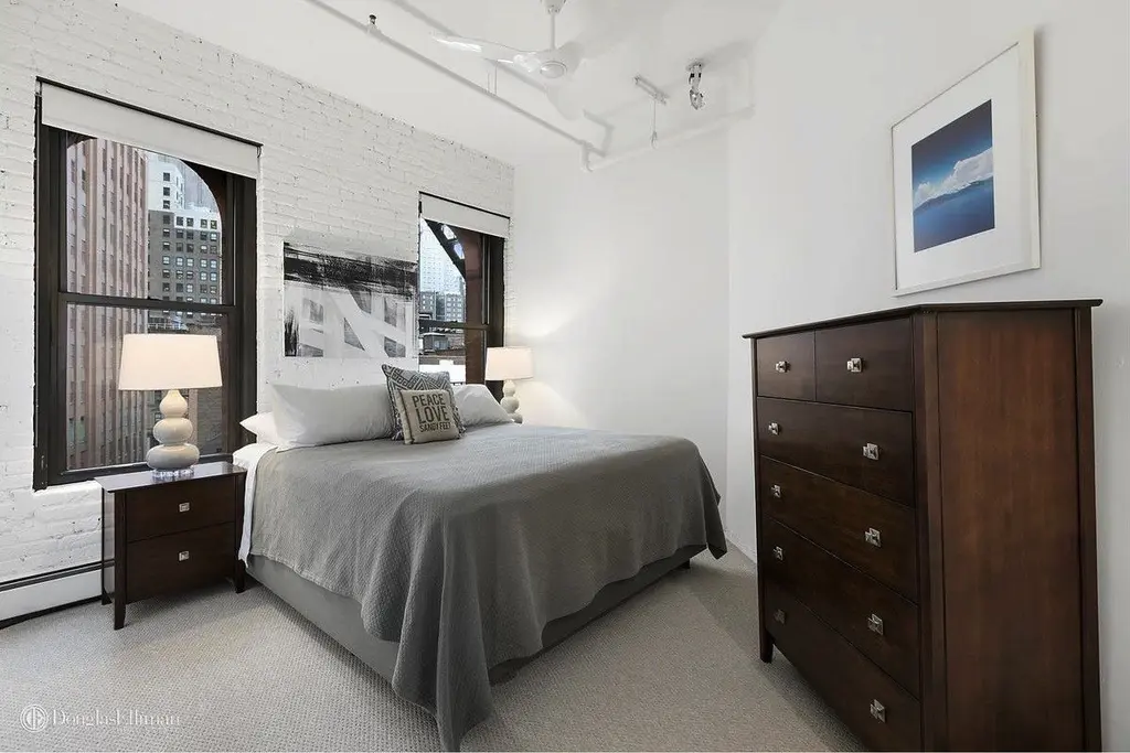 Brick archways and timber beams decorate this $2M Tribeca co-op | 6sqft