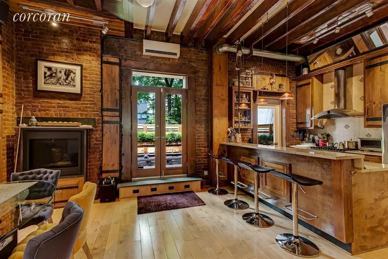 Rich wood and brick decorate this renovated East Village rental, for $13,995/month