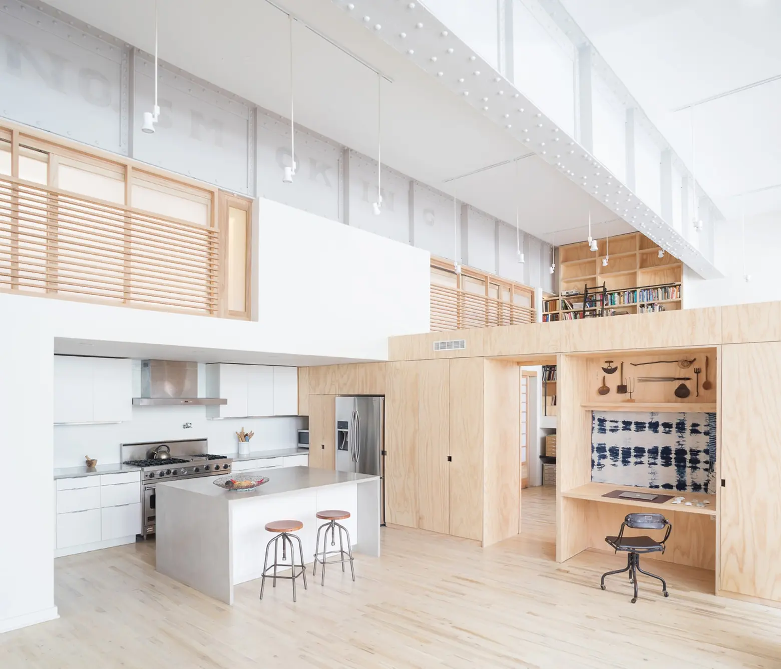 A former Wells Fargo horse stable in Jersey City gets converted into a modern plywood loft