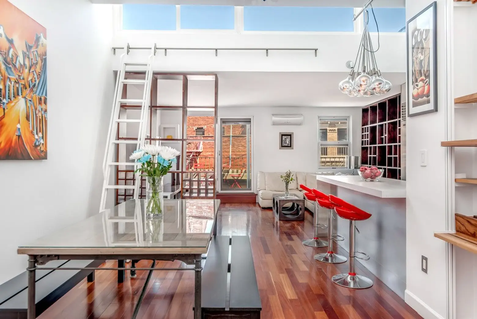 Asking $6,800/month, this compact Nolita penthouse has a sweet rooftop terrace