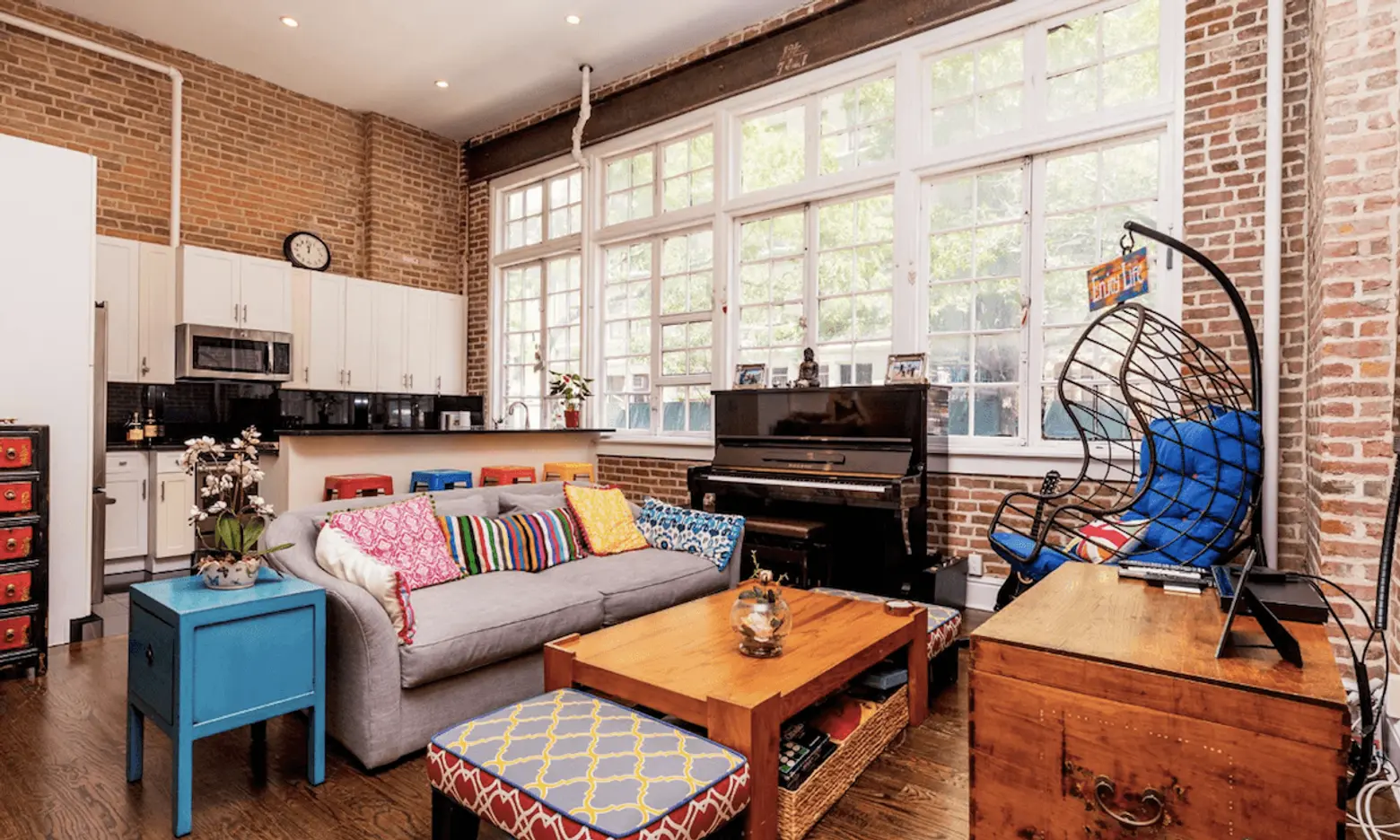 Colorful decor pops against massive brick walls at this $6,950/month Gramercy rental