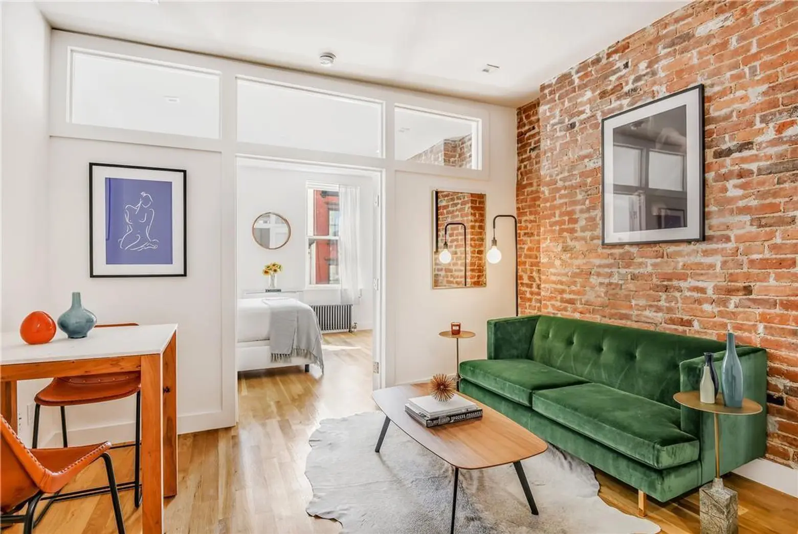 This slender West Village townhouse condo is well-located, well-dressed and just under $1M