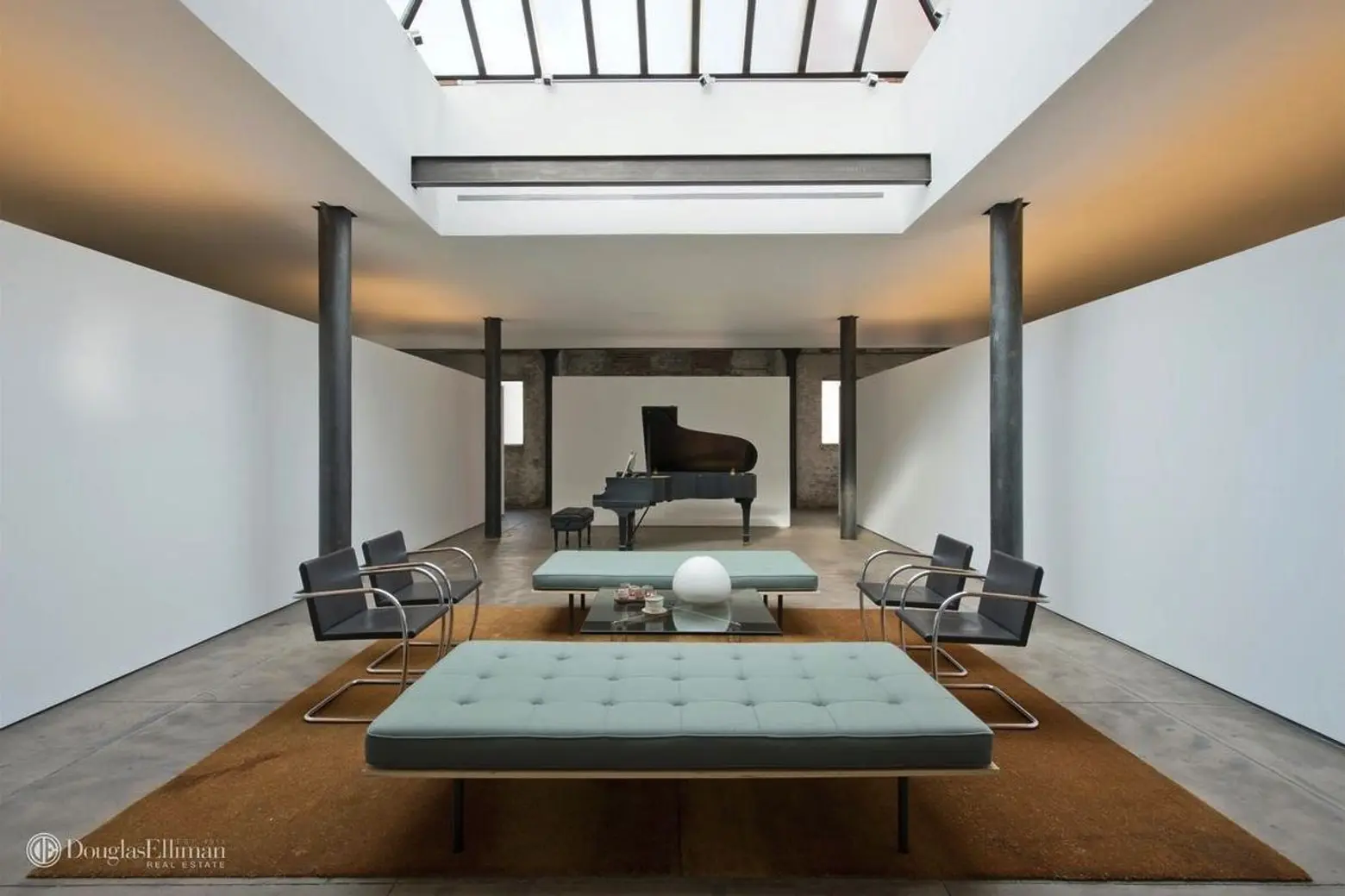For $11M, a former Chelsea parking garage transformed into a concrete-clad apartment