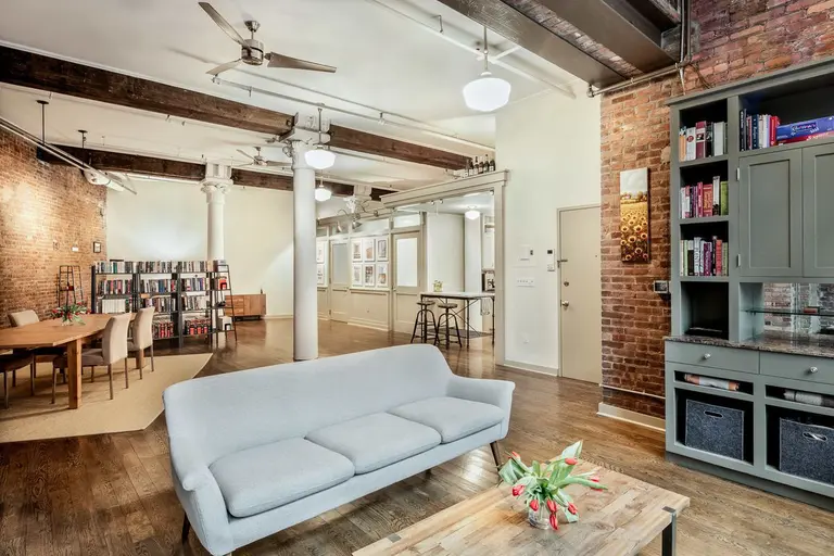 A wall of windows stuns at this $1.8M artsy loft in the heart of Tribeca