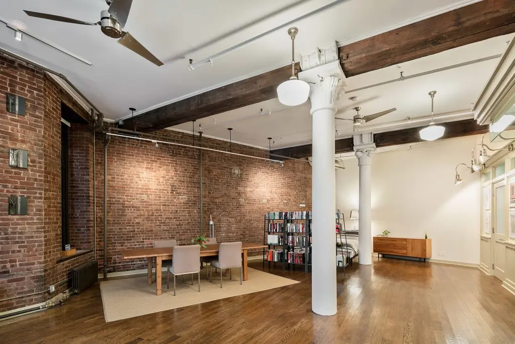 A wall of windows stuns at this $1.8M artsy loft in the heart of ...