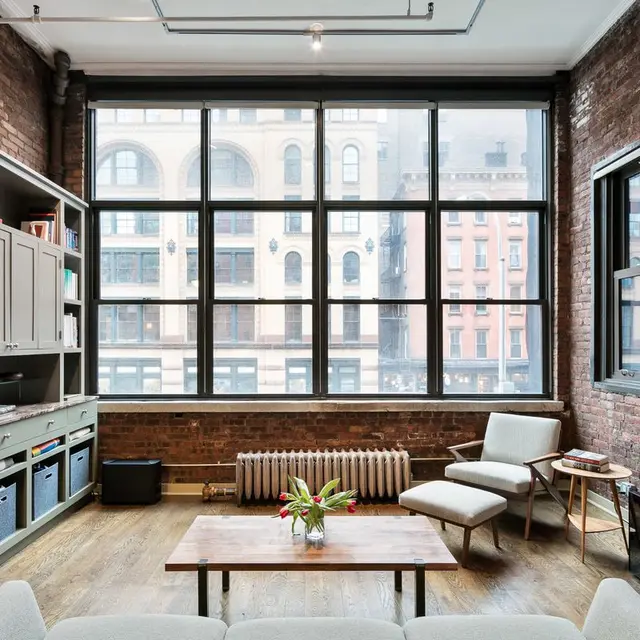 A wall of windows stuns at this $1.8M artsy loft in the heart of ...