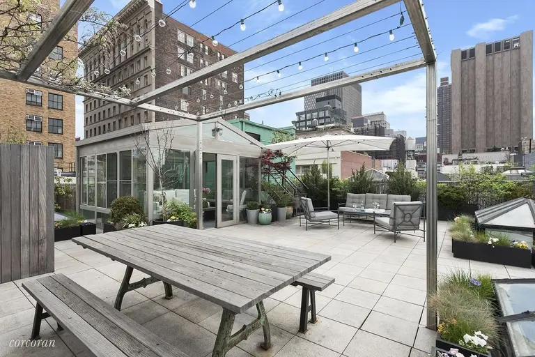 A sunroom turns the private roof deck atop this $3.4M Tribeca loft into an all-season paradise