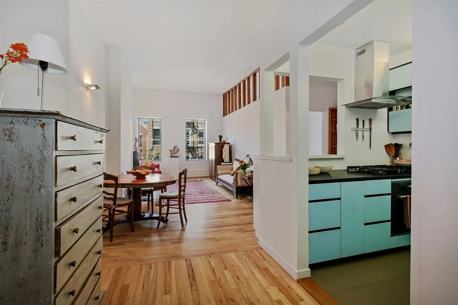 $1.2M East Village condo has a cool blue kitchen and a roof deck with a view