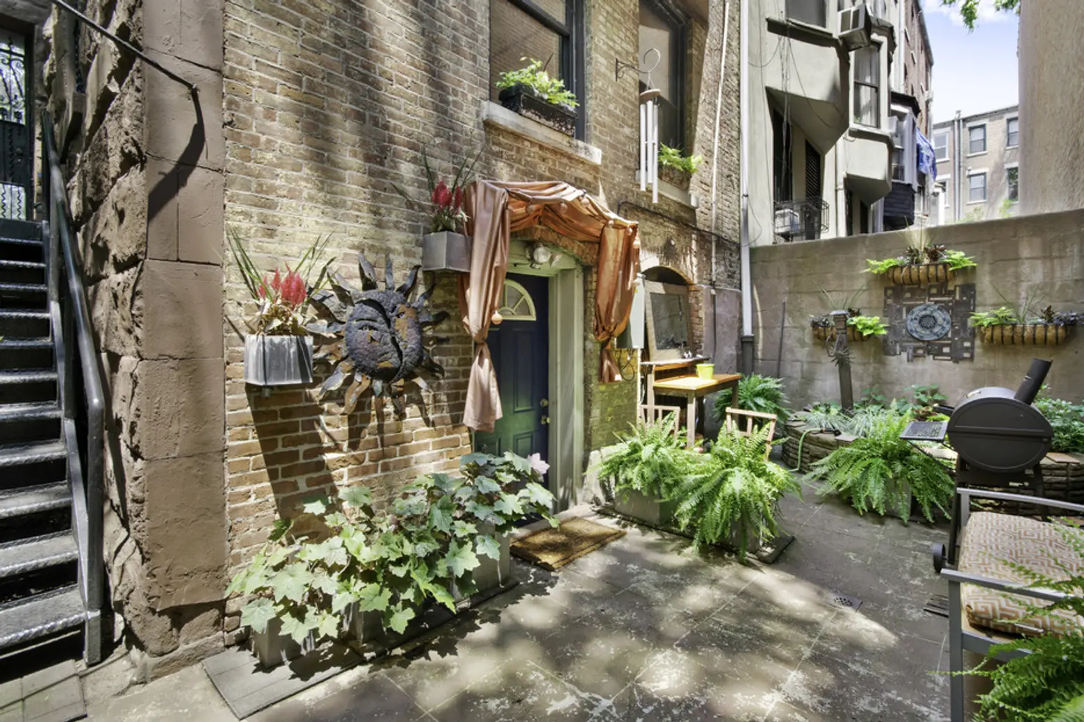 For $2.7M, a Hamilton Heights townhouse with a pretty garden on a historic block