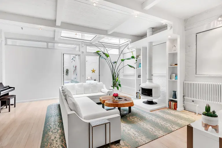 Topped by a 300-square-foot skylight and a rooftop grill, this $3.5M Chelsea triplex is a looker