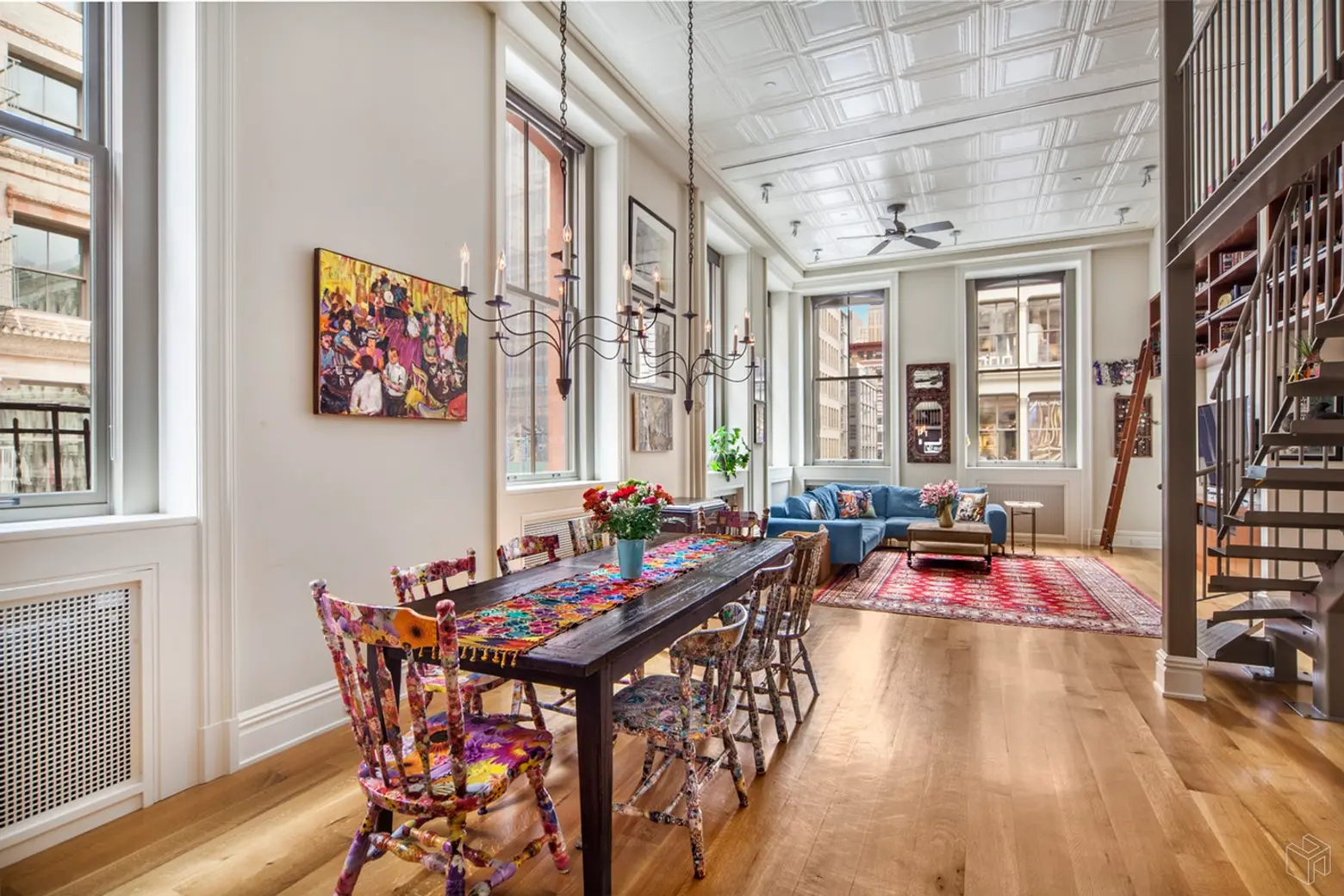 Sleep right under the tin ceilings at this $3.9M Soho co-op with a lofted bonus room
