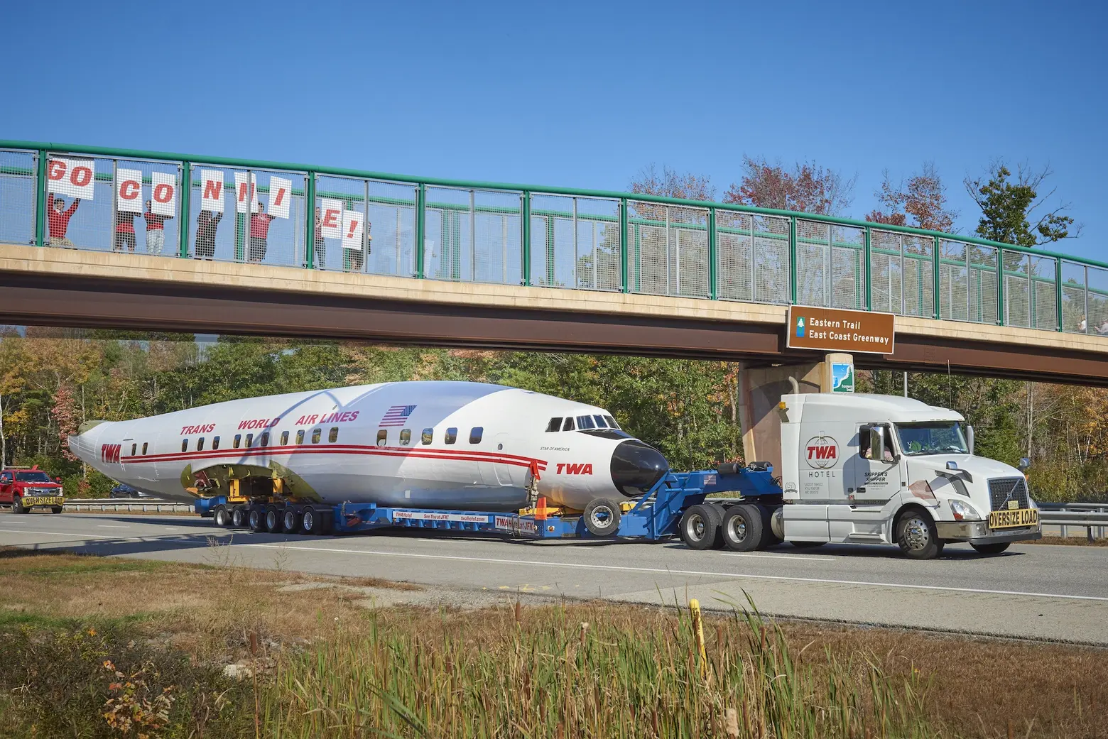 See the TWA Hotel’s airplane-turned-cocktail lounge make the 300-mile journey to JFK via tow truck