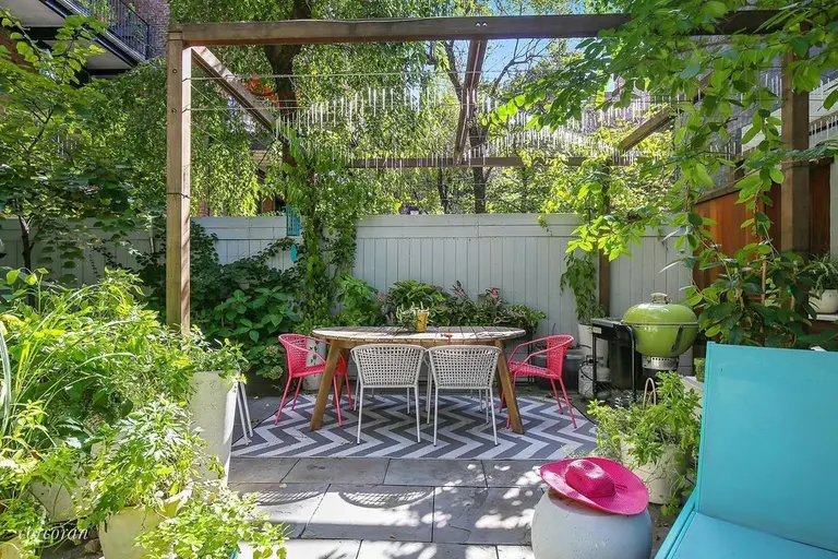 $2.8M Chelsea co-op has an enchanted two-level garden complete with a fire pit and pergola