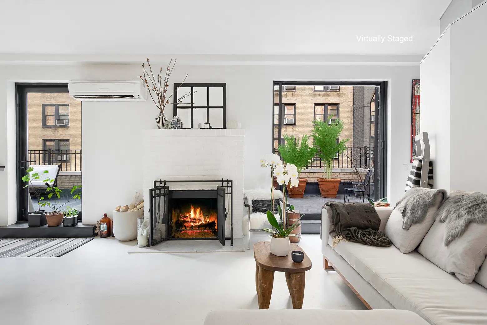 Mod Midtown West penthouse with an enormous wraparound terrace seeks just under $1M