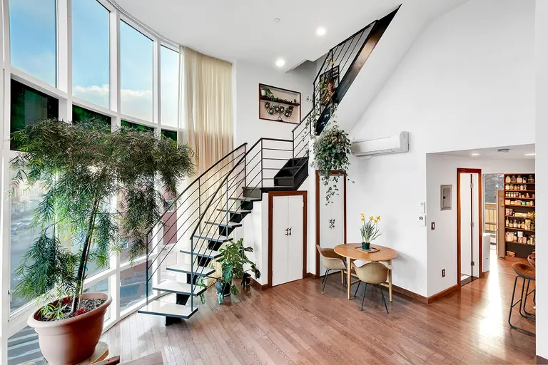 $1.25M Williamsburg triplex comes with two terraces and dramatic curved glass walls