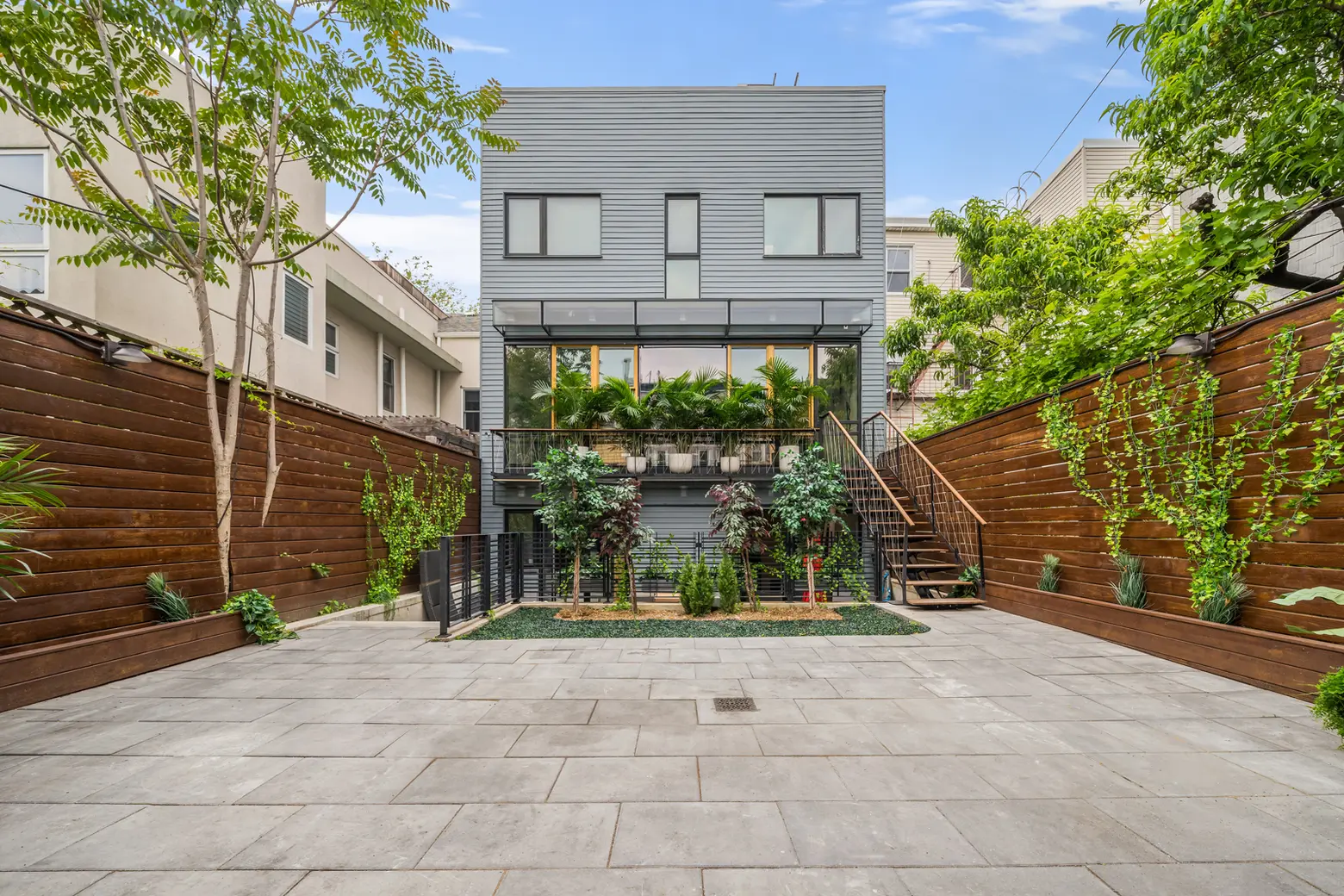 For $5.2M, this Williamsburg townhouse comes with a charming carriage house and lots of outdoor space