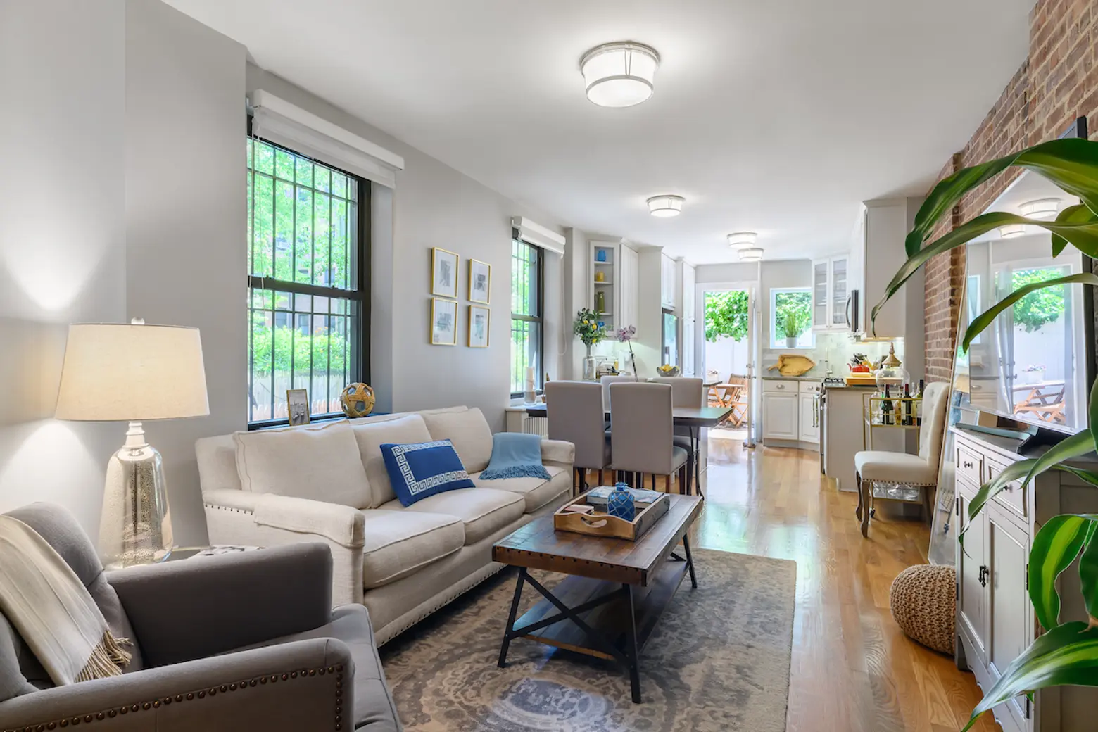 Two rooms of this $1.2M Murray Hill maisonette open onto a private patio garden