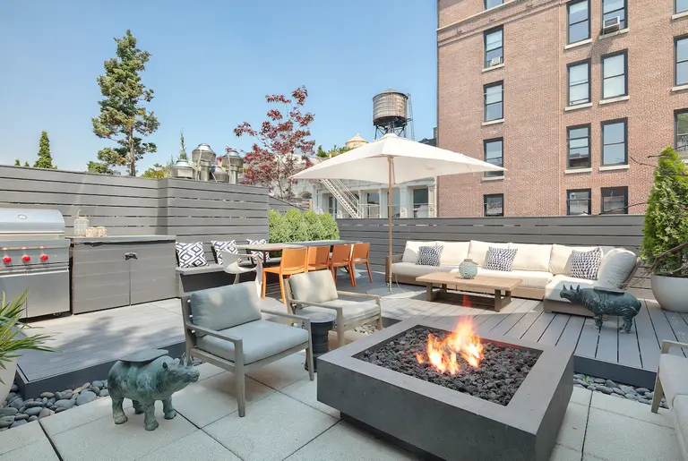 $6.8M Soho penthouse is a modern glass oasis with a roof deck and a fire pit