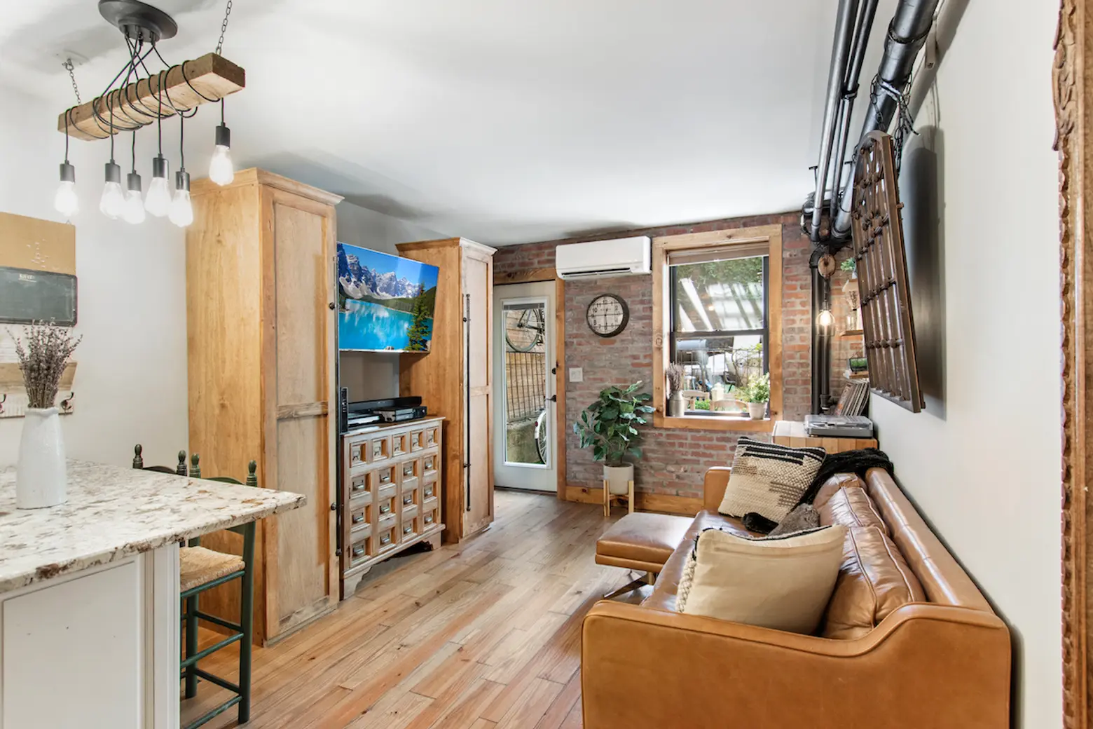 This cozy, quirky $425K Upper East Side studio has an astroturf-clad dream of a backyard